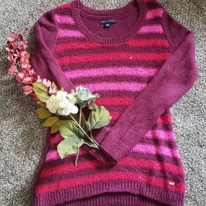 Maroon sweater with pink stripes.  Sequins too.